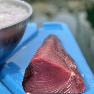 fresh bluefin tuna loin on a blue top